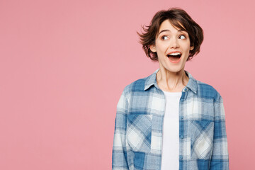 Young shocked surprised amazed excited woman wearing blue shirt white t-shirt casual clothes look...