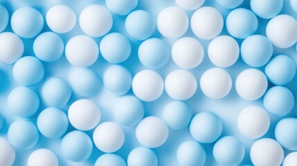 A seamless spread of light blue and white ping pong balls, tightly arranged to fill the entire frame with their smooth, minimalistic texture.