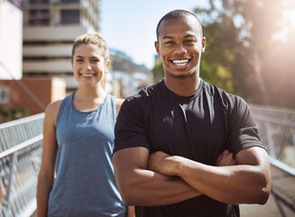 Personal trainer, man and woman in city for portrait, arms crossed and happy for workout on bridge...