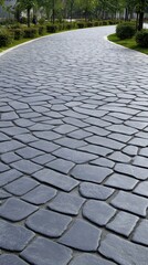 Fototapeta premium A beautifully formed cobblestone pathway curves gracefully through a vibrant garden by a contemporary home surrounded by lush greenery