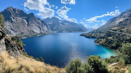 A stunning lake encircled by mountains featuring crystal clear blue water