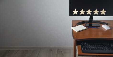 Wooden 5 stars on the workplace. Customer satisfaction