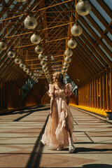 An Elegant Woman Dressed in a Beautiful Flowing Dress Captured in a Modern Architectural Setting