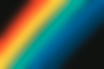 Blurred rainbow like effect on a black background. Colorful spectrum fading into darkness background. Abstract background with a rainbow inspired color scheme. Perfect for creative design