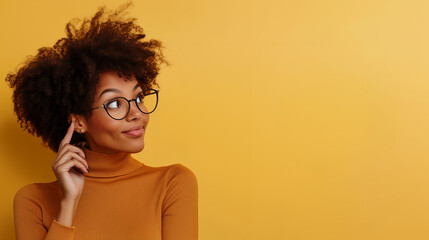 Young, creative, and pretty black woman with glasses thinking about her marketing startup business on isolated dark background with copy space