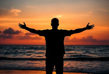 Man standing by the ocean at sunset Man embracing nature Arms outstretched