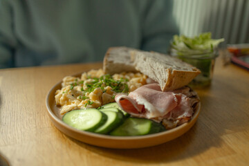 Healthy and tasty toast bread with cucumbers, eggs, ham and cheese on it.