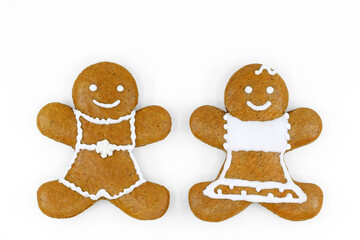 Smiling gingerbread couple on white background 