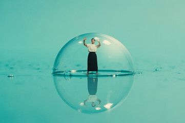 A woman inside a huge soap bubble.