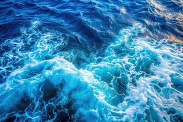 Blue frothy sea water from above
