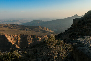 Exploring the stunning natural landscapes of Jebel Shams in Oman during the golden hour at dusk