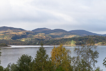 Dramatic landscape of autumn mountains over the northern fjords in Norway. Seasonal scenery of Scandinavia.
