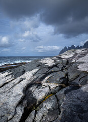 A beautiful textured rocks on the Tungeneset beach, Senja, Norway. Seasonal scenery of Scandinavia.