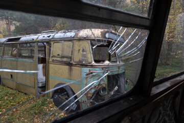 Close up details of abandoned living bus in the forest of Northern Norway. Seasonal scenery of Scandinavia.