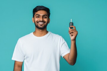 A person holding a cell phone and toothbrush, possibly getting ready for bed
