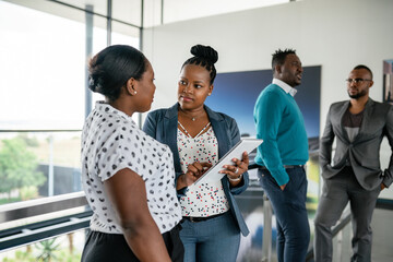 Diverse African Professionals Engaged in Business Meeting Discussion