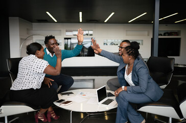 Successful african Business Meeting with Team High-Fiving in Office
