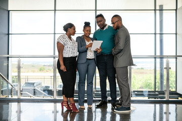 Diverse African Business Team Collaborating in Modern Office Building