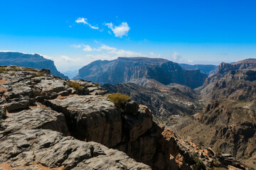 Breathtaking view from Jebel Akhdar in Oman showcasing dramatic mountains and clear skies capturing the beauty of nature at midday