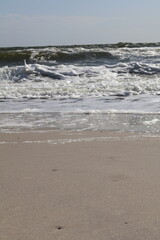 Gentle Ocean Waves Rolling onto Sandy Beach