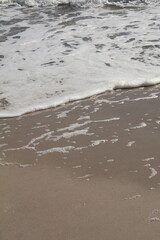 Gentle Ocean Wave Reaching Sandy Shore