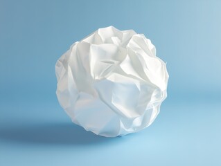 Obraz premium Crumpled paper isolated on blue background. Paper crumpled into a ball. Recycling, ecology, business concept.