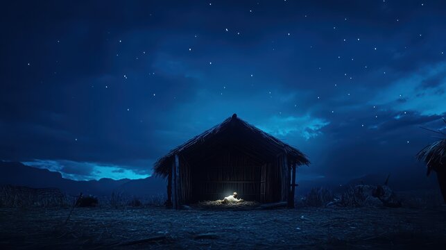 Nativity scene depicting the birth of Jesus Christ in a wooden manger, set against a dark blue night, suitable for banners and headers, with copy space, captured using a DSLR camera.