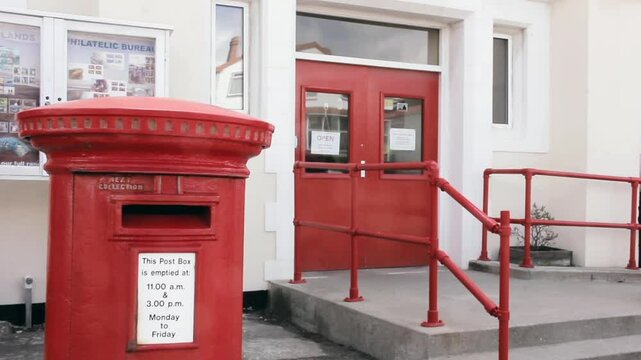 Red Post Box at the Philatelic Bureau Entrance in Stanley, Falkland Islands (islas Malvinas)