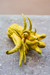 Buddha's hand lemon on a rustic background