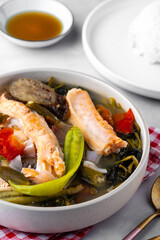 Salmon Belly Sinigang with tomato, kangkong, okra and other vegetables