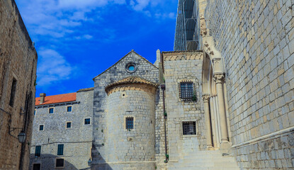 Exploring the charming streets of Dubrovnik Croatia with historic stone buildings under a clear blue sky