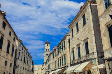Strolling through the historic streets of Dubrovnik Croatia under a clear blue sky on a sunny day