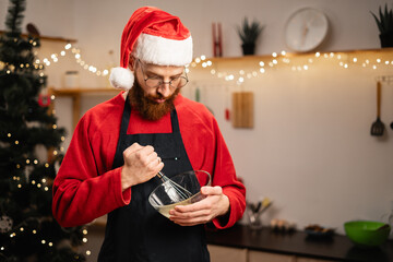 Man whisking ingredients for Christmas cookie dough preparation