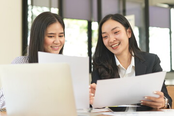 Asian woman succeeds at office