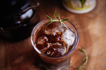 Close-up of refreshing Espresso Tonic, cold-brew tonic on a wooden table