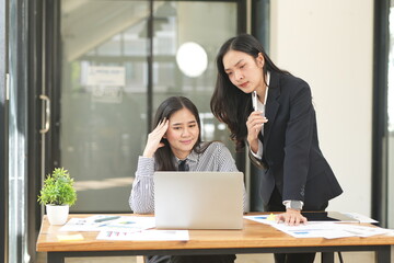 Asian woman succeeds at office