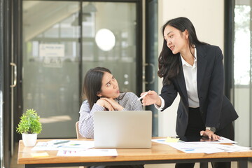 Asian woman succeeds at office