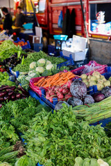 Vibrant vegetable display at a local market in Turkey showcasing fresh produce on a sunny day