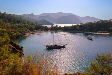Scenic view of Fethiye coastline featuring boats on calm waters during a sunny day