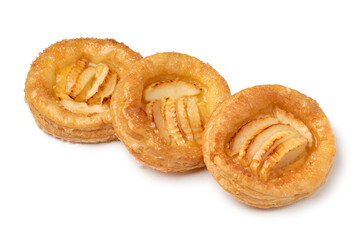 Row of fresh homemade puff pastry apple biscuit isolated on white background close up