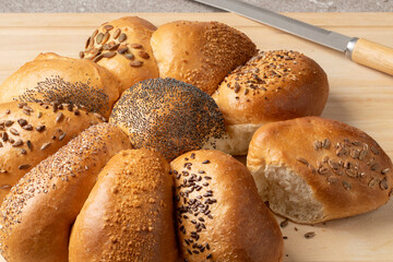 Fresh homemade loaf of wheat bread in flower shape with a variation of seeds close up