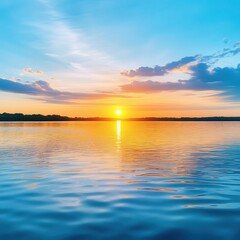 Fototapeta premium Stunning sunset over calm water, reflecting vibrant hues of orange and blue, creating a serene atmosphere for relaxation.