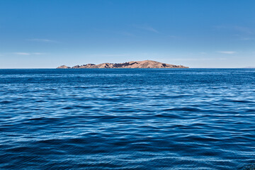 Fototapeta premium Discovering the hidden gem of Lake Titicaca Suasi Island. A serene escape where nature meets Tranquility, offering breathtaking views and a glimpse into the rich culture of Peru. Every moment here fee
