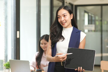 Asian woman succeeds at office