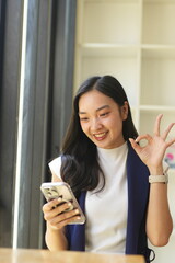 Asian woman succeeds at office