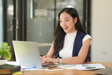 Asian woman succeeds at office