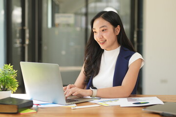 Asian woman succeeds at office