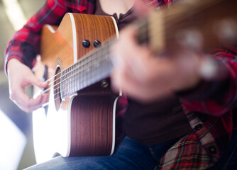 Of a girl holding a guitar