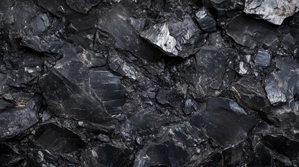 A rich, black coal texture background, emphasizing the rough, earthy surface and natural feel of this energy-rich mineral.