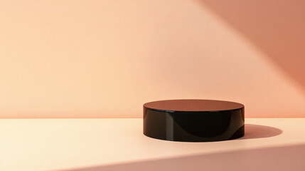 glossy black pedestal stands elegantly against soft peach background, casting subtle shadows that enhance its sleek design. This minimalist display piece adds touch of modern sophistication to any